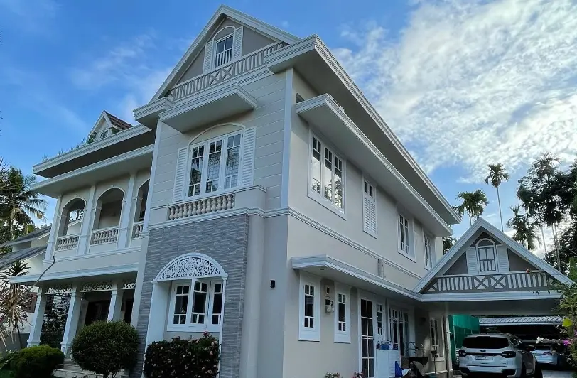 House with beautiful window designs and light paint colours